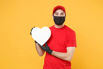 Delivery man in red cap blank t-shirt uniform sterile face mask gloves isolated on yellow background studio Guy employee working courier Service quarantine pandemic coronavirus virus 2019-ncov concept