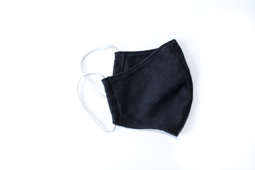 A black cloth mask in a white scene