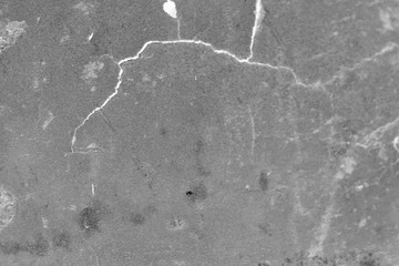 Gray dirty background with a white crack.