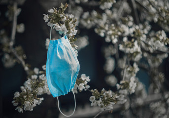 Face mask on the flowering tree