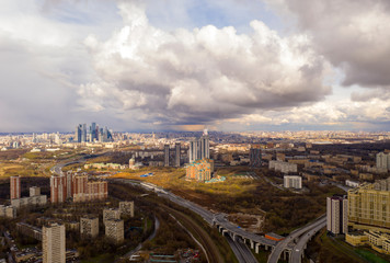 Fototapeta premium industrial views of a big city at sunset filmed from a drone