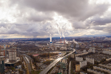 industrial views of a big city at sunset filmed from a drone