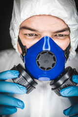 Close up portrait image of a health worker wearing protective clothing and masks working with Vaccines for dangerous viruses