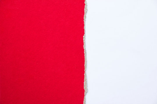 Red torn piece of cardboard paper on white background. Copy space for text message.