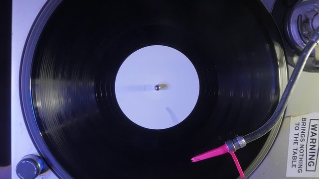 4K - DJ Turntable Spinning While Placing Needle On Vinyl Record - Slow Zoom