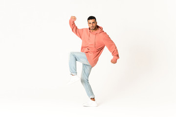 Man dancing street dance style over isolated white background