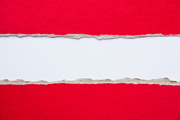 Red torn pieces of cardboard paper on white background. Copy space for text message.