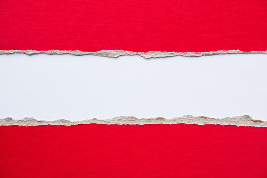 Red torn pieces of cardboard paper on white background. Copy space for text message.