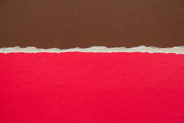 Red and brown torn sheet of cardboard paper texture background. Can be used for text message.