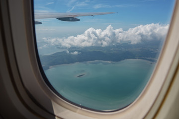Fototapeta premium View from the window of the airplane on the wing, sky and clouds.