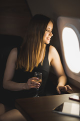 Attractive woman in private jet