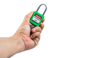 Hand holding green key lock and tag for process cut off electrical,the toggle tags number for electrical log out tag out on white background