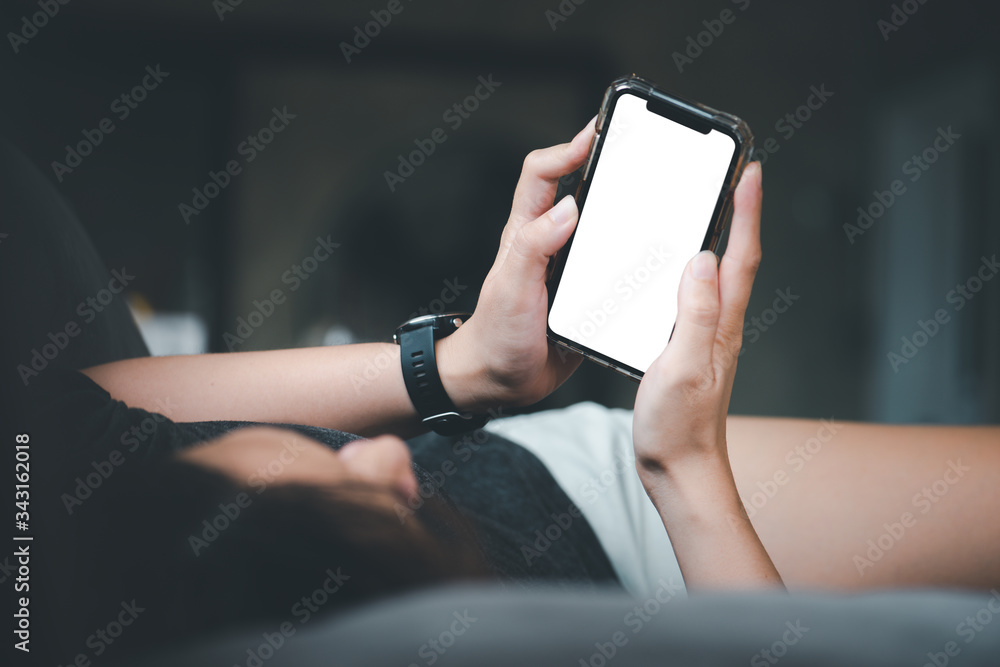 Aufkleber a girl using a smartphone with a blank white screen for use in designing and advertising media. onli