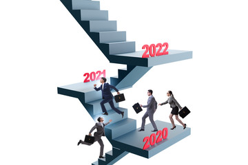 Businessman climbing stairs on yearly basis