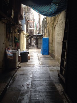 Wet Alley Amidst Houses