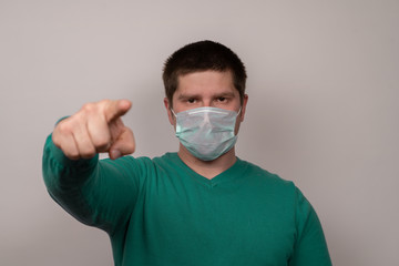 A man in a medical mask on a white background