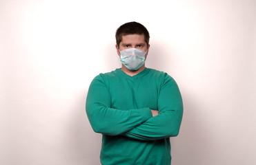 A man in a medical mask on a white background