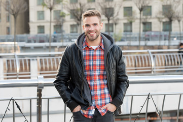 Handsome student. Male fashion. Waiting for you. Just relaxing here. Man wearing leather jacket....