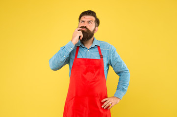 Make healthy decisions when ordering food at restaurant. Plan weekly meals. Cooking control each meal you make. Hipster in apron thinking about recipes. Easy to cook recipes. Unique healthy recipes