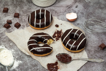 chocolate donuts on baking paper
