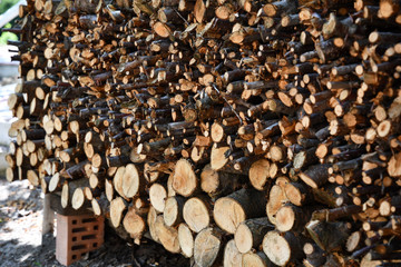 Stack of firewood. Natural wooden textures. Timber backgrounds. Sawed woods details. Lumber industry backdrop