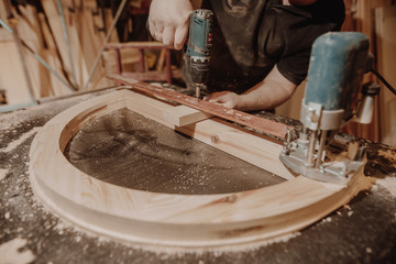 Joinery concept, professional joiner, carpenter making the furniture, woodwork, handcraft, manufacture work