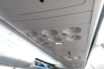 Control panel for ventilation and lighting in a passenger seat in an airplane