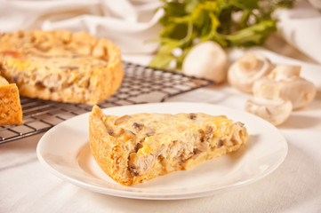 Obraz na płótnie Canvas Homemade freshly tasty French quiche Lorraine tart pie with chicken meat and mushrooms.