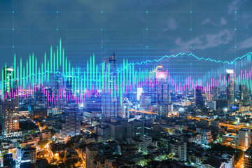 Obraz na płótnie Canvas Night time view cityscape of Bangkok city background with financial graph. Success and finance concept. Multiexposure