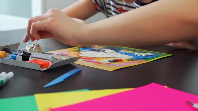 Close-up of Mother and Daughter Crafting with Colorful Modeling Clay at Home. Concept of Art, Handmade Crafts, Hobby and Activities for Children