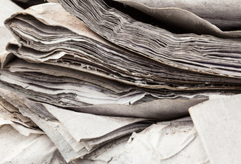 Old useless paper documents on the landfill