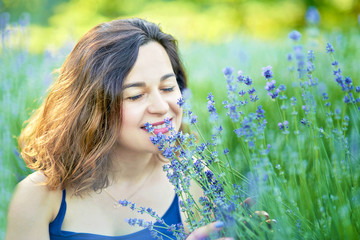 Beautiful girl in lavender field on sunset in France. Girl collect lavender. Series. pregnancy outdoors. Maternity. pregnant woman with bouquet of lavender