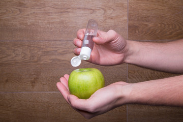 washing and cleaning the green apple with antiseptic products before use