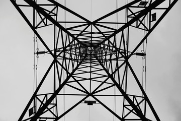 Directly Below Shot Of Silhouette Electricity Pylon Against Clear Sky