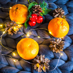 New year Christmas Christmas Flatley with tangerines candle garland and pine cone