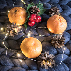 New year Christmas Christmas Flatley with tangerines candle garland and pine cone