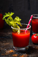 alcoholic cocktail bloody mary on dark background, vertical closeup