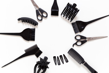 hairdresser equipment placed as round frame on flat lay with copy space in the middle