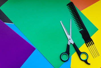 Hair cutting scissors. Thinning scissors. Top view of scissors isolated on a colored background.