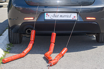 Just Married Sign Attached On Car's Trunk