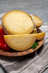 Italian semi hard matured caciocavallo cheese, handmade and aged in natural underground caves in Apulia region