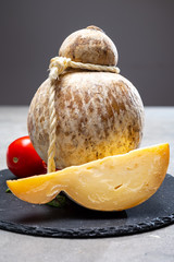 Italian semi hard matured caciocavallo cheese, handmade and aged in natural underground caves in Apulia region