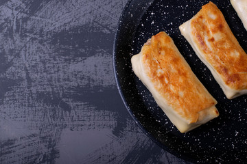 Pancakes with filling roasted on the pan