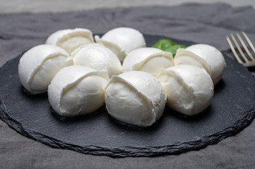 Tasty italian food, fresh white buffalo mozzarella soft cheese balls from Campania