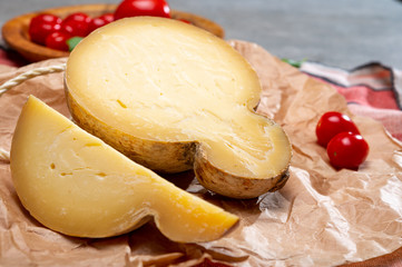 Italian semi hard matured caciocavallo cheese, handmade and aged in natural underground caves in Apulia region