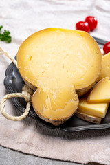Italian semi hard matured caciocavallo cheese, handmade and aged in natural underground caves in...