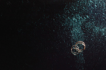 rings and water drops on a black background