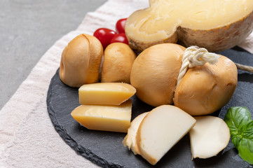 Italian semi hard handmade smoked scamorza and caciocavallo matured in caves cheeses made from cow...