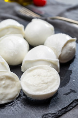Tasty italian food, fresh white buffalo mozzarella soft cheese balls from Campania
