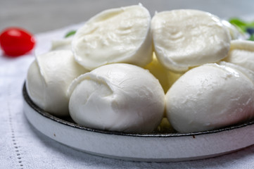 Tasty italian food, fresh white buffalo mozzarella soft cheese balls from Campania